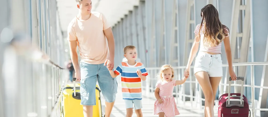 Happy family in airport departures. People in terminal preparing for the vacation